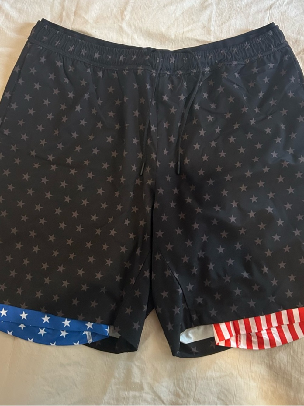 chubbies Black Swim Trunks with Red & Blue Stars and Stripes Accents